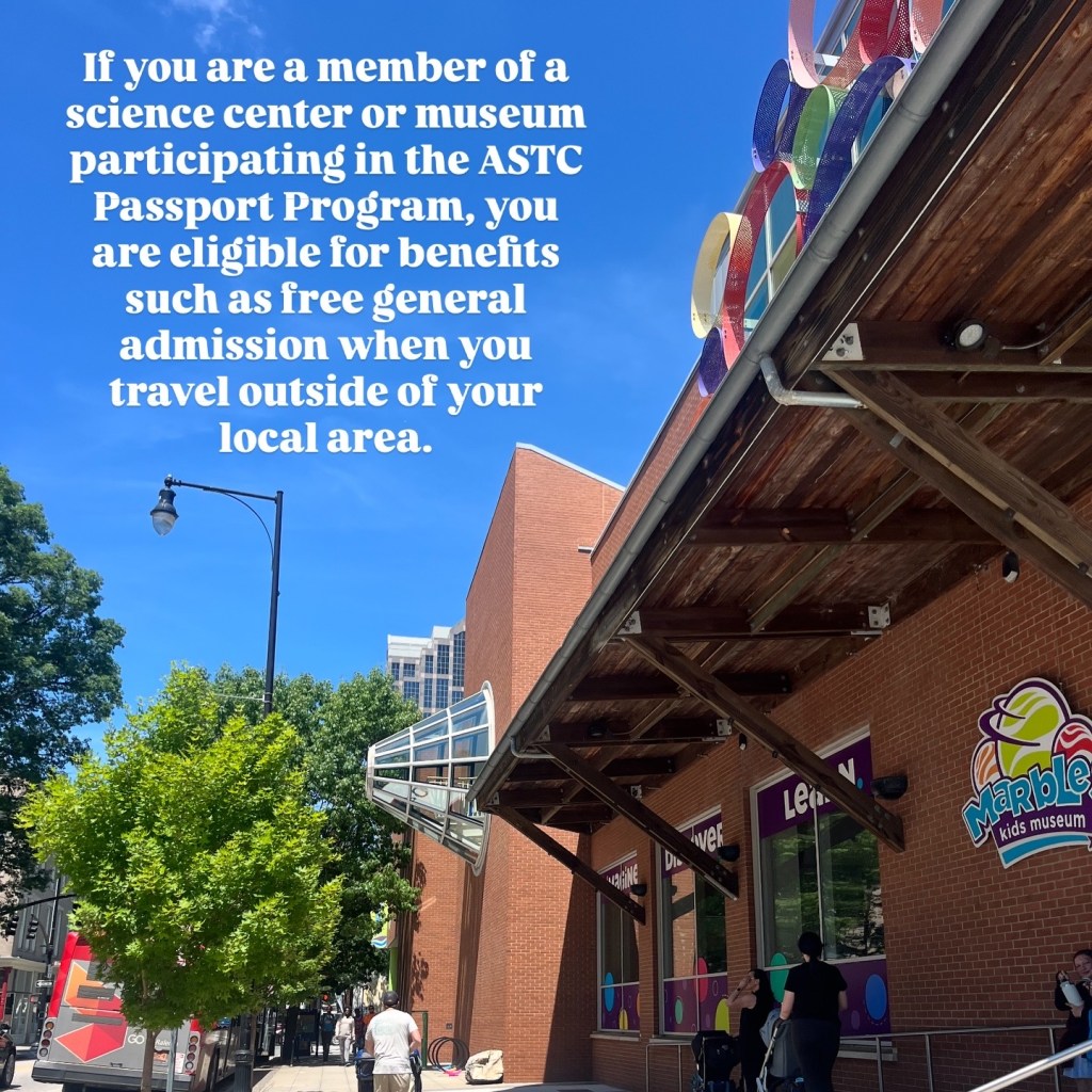 Exterior view of a children's museum building with colorful signage, surrounded by trees and people walking, under a clear blue sky. Text on the image promotes the ASTC Passport Program for museum members.