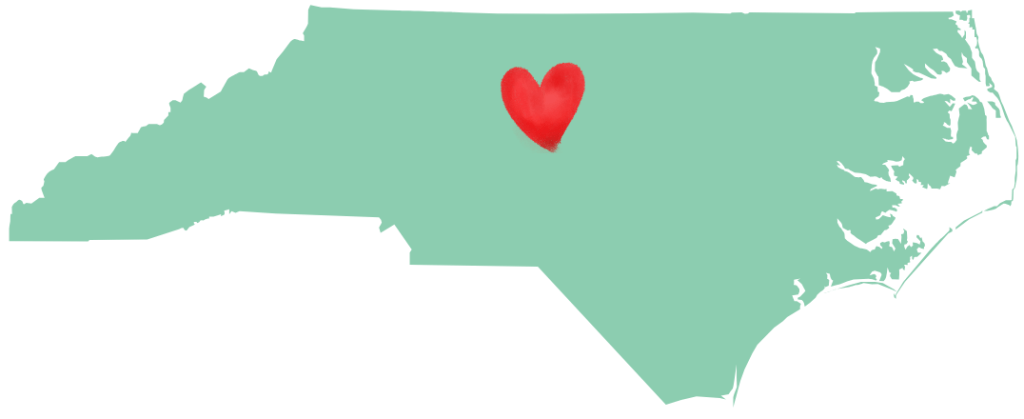 Map of North Carolina with a heart symbol indicating the central region.