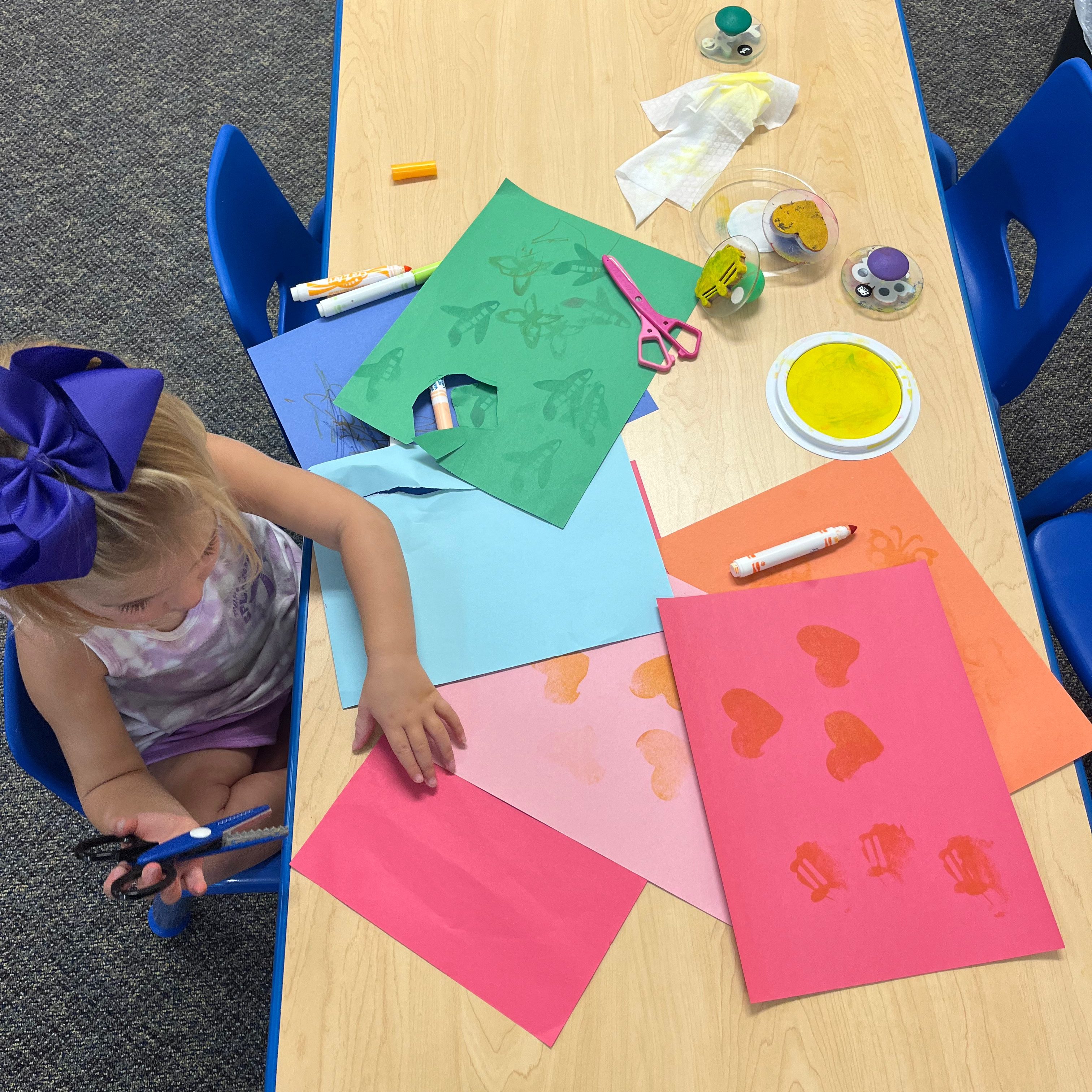 girl cutting paper